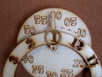 Gear Clock. New design style. Minute face is the whole cutout of hour wheel gear. Minute hand is traditional type for easier reading. Stencil cut. by TexasLaser