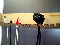 Customizable laser cut cable holder by damo