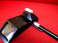 Smart phone spectrometer cuvette holder by cfastie