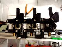 Triple Bowden Rubberband Extruder Drive for Tri-colour by reversehaven