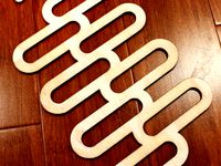 Lasercut Tie Holder for Metal Closet Rods by jamaicasdarlin
