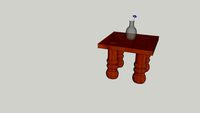 Wooden table with flowers in a Vace on it